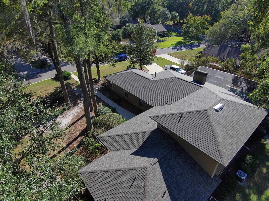 Completed residential roofing project in Gainesville, Florida, featuring durable gray shingles by Atlantic Roofing & Exteriors LLC